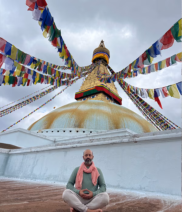 A great white stupa crossed with prayer flags