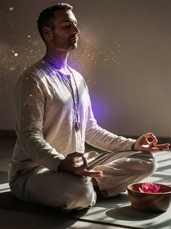 A man in meditation with light at the throat